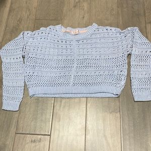 Light blue sweater/over shirt, size medium for juniors.